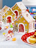 Gingerbread houses with candy canes and sweets