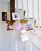 Christmas cards and fairy lights on banister rails