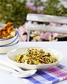 Spaghetti with seafood, rocket and pine nuts