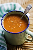 Tomato and lentil soup with thyme in a mug