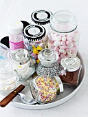 Various cake decorations in jars