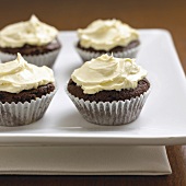 Four cupcakes on square plate