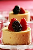 Individual cheesecakes with raspberries and blackberries