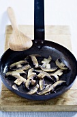 Fried mushrooms in frying pan