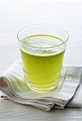 A glass of freshly pressed green apple juice