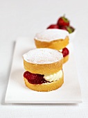 Small sponge cakes with strawberry and cream filling