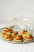 Blinis with carrot butter and beansprouts