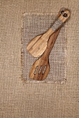Wooden kitchen utensils on jute cloth