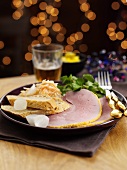 Ham with a honey crust, bread and silver onions for Christmas dinner