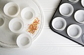 A muffin tin with paper cases