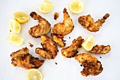 Deep-fried chicken pieces with lemon