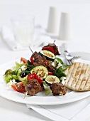 A lamb kebab with courgette