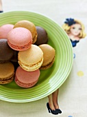 Macaroons on a green plate