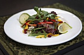 Mixed leaf salad with vegetables and pomegranate seeds