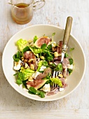 Mixed leaf salad with raw ham, figs and goat's cheese