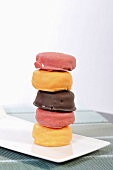 A stack of biscuits with decorated with icing
