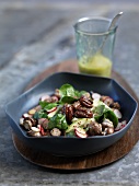 Baby spinach with spicy pecan nuts and a mustard dressing