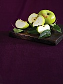 Fresh green apples with leaves