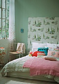 Double bed with wallpapered head