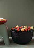 Colourful little cacti in purple ceramic planter