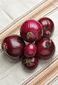 Red onions on a cloth