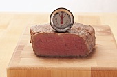 The core temperature of a beef steak being taken (medium)