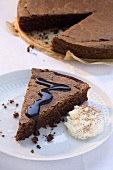 Chocolate cake with chocolate sauce and cream