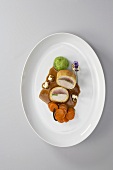 Quail and chicken breast in corn sponge with vegetables