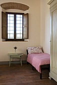 Guest room with bed in a Mediterranean country home