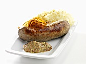 Sausage with mustard, onions and mashed potatoes