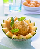 Melon sorbet with basil in a hollowed out melon