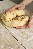 Raw yeast dough with raisins and candied fruit