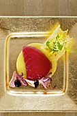 Marinated tuna with olive cream and squid