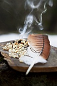 Smoking incense and a feather