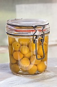 A jar of preserved mirabelles