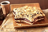 A start-shaped chocolate cake with banana cream and slivered almonds