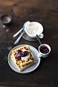 Buttermilk waffles with plum compote and whipped cream