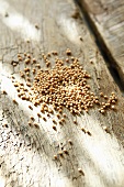 Mustard seed on a wooden surface