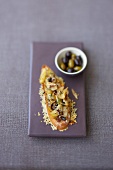 Onion toast with anchovies and olives