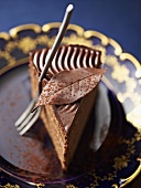Truffle cake with a chocolate leaf