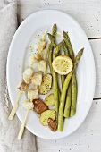 Monk fish kebabs with green asparagus and fried potatoes