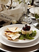Brie with cranberry sauce and unleavened bread