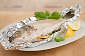 Sea bass cooked in aluminum foil
