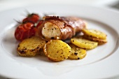 Monkfish wrapped in bacon with roasted potatoes