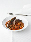Wagyu sausage with beans, tomatoes and vegetables