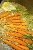 Baby carrots cooking in butter