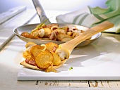 Roast potatoes with onions, bacon and mushrooms