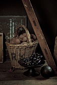A rustic arrangement of potatoes and grapes