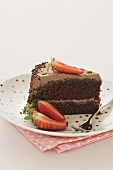 A slice of chocolate cake with strawberries