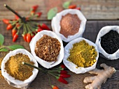 Various spices in paper bags (seen from above)